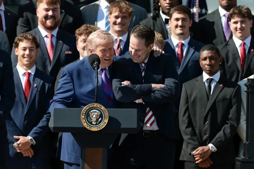 U.S. President Donald Trump reacts with head football coach at Indiana University, Curt Cignetti, as the president hosts the 2026 College Football Playoff (CFP) National Champions from Indiana University at the White House in Washington, D.C., U.S., May 11, 2026. REUTERS/Evelyn Hockstein